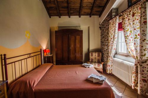 Postel nebo postele na pokoji v ubytování Agriturismo Chioi