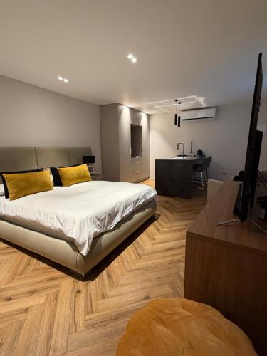 a bedroom with a large bed and a table at rooms 48 in Eilat