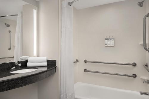 a bathroom with a sink and a shower at Holiday Inn Santee by IHG in Santee