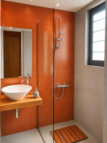 a bathroom with a sink and a shower at Óros Residence - Pool & Panoramic Views in Tzíkidhes