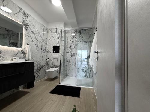 a bathroom with a shower and a toilet at Villa Omorfia - SEVID in Sevid
