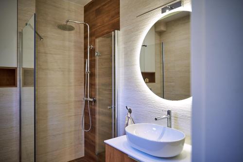 a bathroom with a sink and a mirror at Nad Drwęcą in Mszano