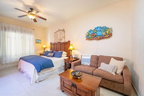 a bedroom with a bed and a couch at Stunning home - Amazing Mountain Views in Loreto