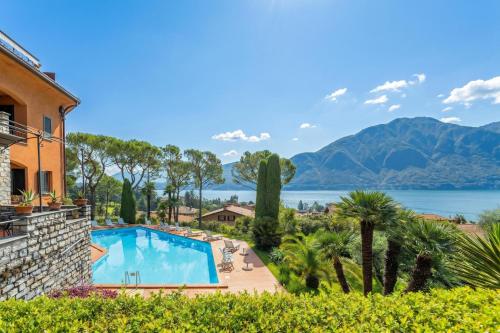a resort with a swimming pool and a view of the water at Brentano Elegante in Mezzegra