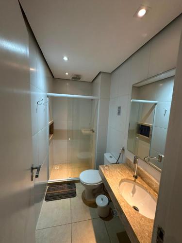 a bathroom with a toilet and a sink and a shower at Ibiza Experience Resort in Angra dos Reis