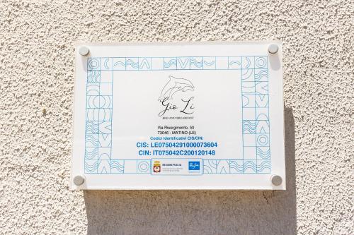 a ticket is taped to the side of a wall at GioLì in Matino