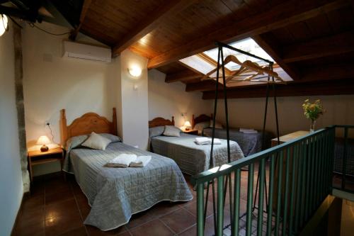 Кровать или кровати в номере Casas Rural Calaceite