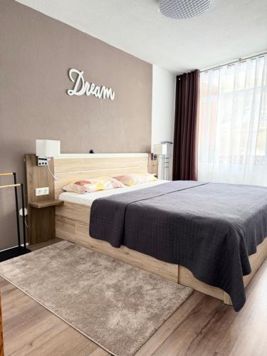 a bedroom with a large bed in a room at Ferienwohnung am Schluchsee mit Balkon & Pool in Schluchsee
