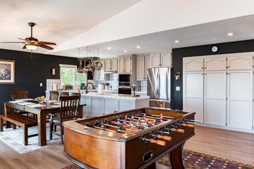 a kitchen with a pool table in a living room at Copperopolis Home - Lake Access & Mtn Views in Copperopolis