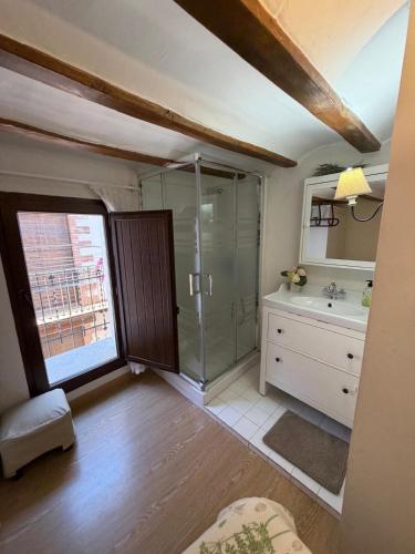 a bathroom with a shower and a sink at Casita del Castillo Mora de Rubielos in Mora de Rubielos