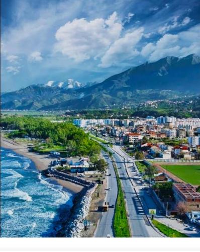 an aerial view of a city with a beach and water at Appartement Aokas Béjaïa in Aokas