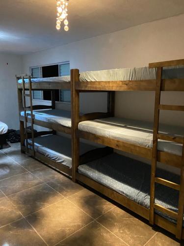 a room with bunk beds in a room at Tucanos Club in São Paulo