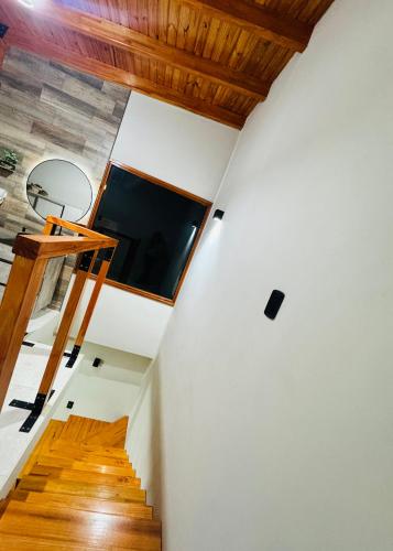 a room with a basketball hoop on the wall and stairs at Refugio Andino in Tupungato