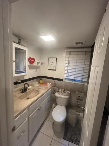 a bathroom with a toilet and a sink at Perfect Studio with AC near NYC in West New York