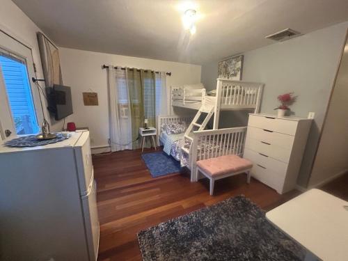 a small room with a crib and a bunk bed at Perfect Studio with AC near NYC in West New York