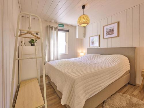 a bedroom with a bed and a ladder in it at Barri in Zutendaal