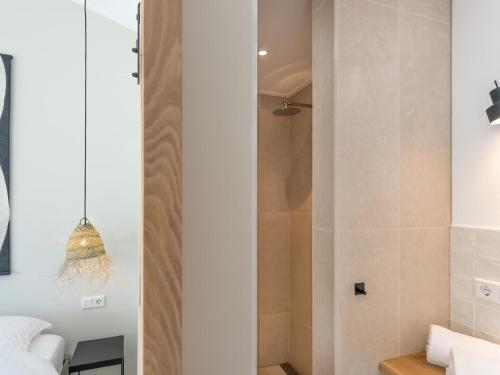 a bathroom with a shower and a toilet at Zilte Suite in Oostkapelle
