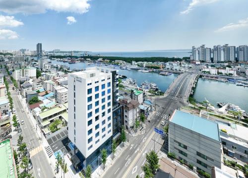 an aerial view of a city with a river and buildings at 포항시티호텔 in Pohang