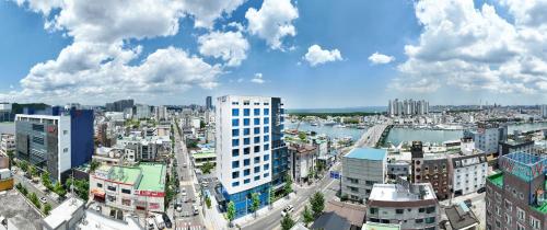 a view of a city with buildings and a river at 포항시티호텔 in Pohang