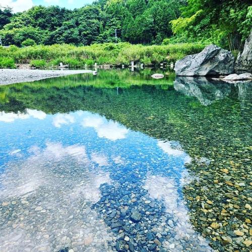 a body of water with rocks and trees at SEN RETREAT CHIKATSUYU - Kumano Kodo Gateway in Tanabe