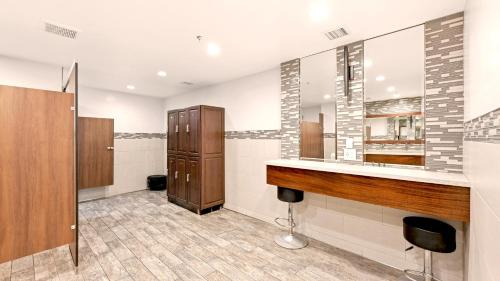 a bathroom with a sink and a mirror at B301 - Seaclusion - On-the-Sand in Oceanside