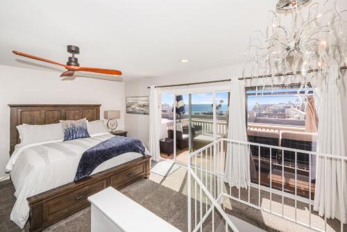 a bedroom with a bed and a large window at B306 - Endless Summer in Oceanside