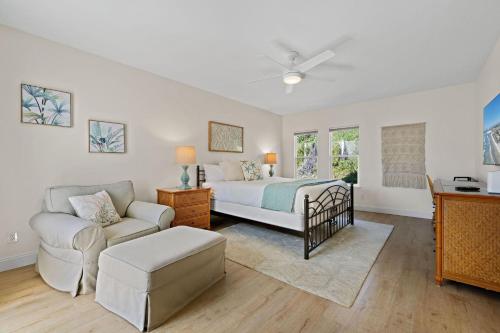 a bedroom with a bed and a couch at Sunset On The Strand in Oceanside