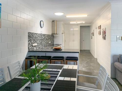 a kitchen with a counter and stools in a room at Arcadia Beach Unit 3 in Arcadia