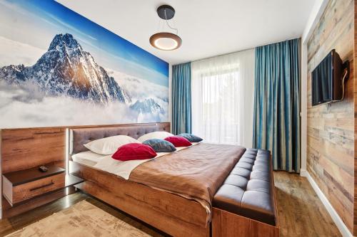 a bedroom with a large bed with a mountain mural at Mariah Spa Deluxe Adults Only in Poiana Brasov