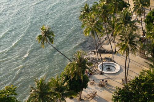 an aerial view of a beach with palm trees at Dinso Resort & Villas Ko Chang, Vignette Collection by IHG in Ko Chang