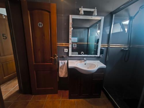 a bathroom with a sink and a mirror at LANZATE! in Tinajo