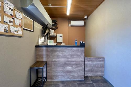 a bar in a restaurant with a counter at HOTEL R9 The Yard Kumamotoozu in Kumamoto