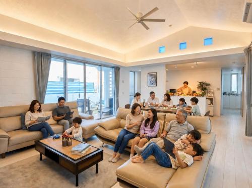 a group of people sitting in a living room at Sea Side Loco's in Yaka