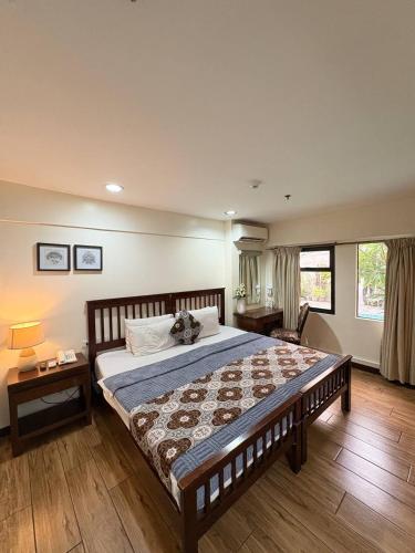 a bedroom with a large bed in a room at 1775 Adriatico Suites in Manila