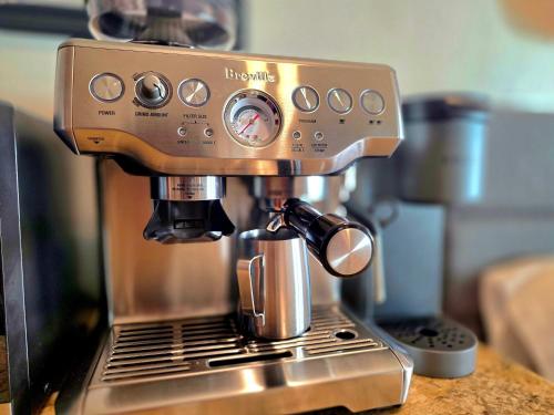 a coffee machine sitting on top of a counter at Oceanfront studio see whales and dolphins in Pahoa