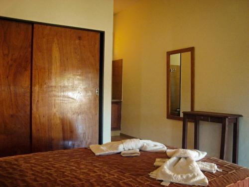 Кровать или кровати в номере Hotel Marengo