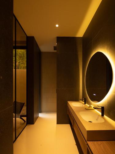 a bathroom with a sink and a mirror at KW3 Villas in Mae Nam
