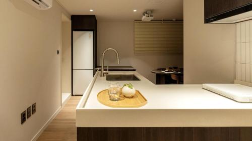 a kitchen with a sink and a counter top at Anook Stay Daejeon Daeheung in Daejeon