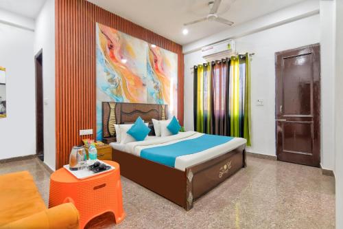 a hotel room with a bed and a couch at Hotel Radha Rani Bhawan in Vrindāvan