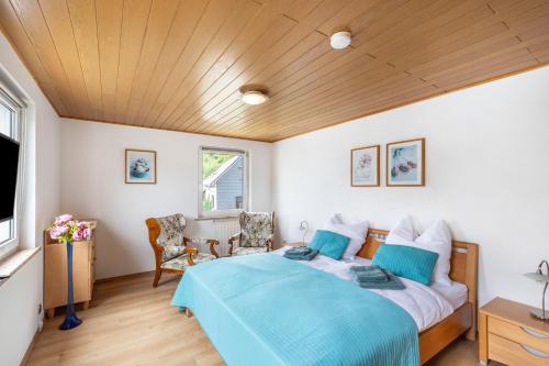a bedroom with a bed and a television in it at Auszeit im Grünen in Bad Schwalbach