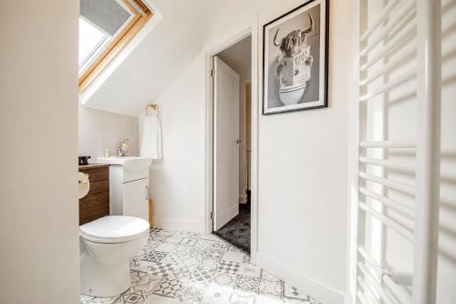a bathroom with a toilet and a sink at Groups Haven 5 Bed 2 Bath Hot Tub Pool Table in Attercliffe