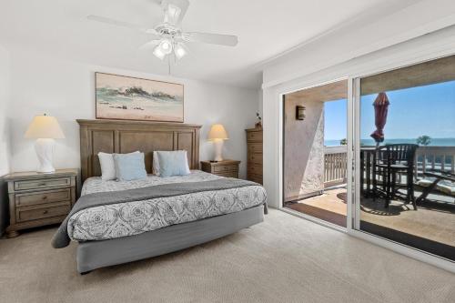 a bedroom with a bed and a view of the ocean at A304 - Sail Away Stay in Oceanside