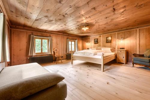 a bedroom with a bed and a wooden ceiling at Ferienhaus Victoria in Schruns