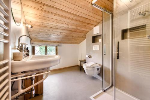 a bathroom with a sink and a shower at Ferienhaus Victoria in Schruns