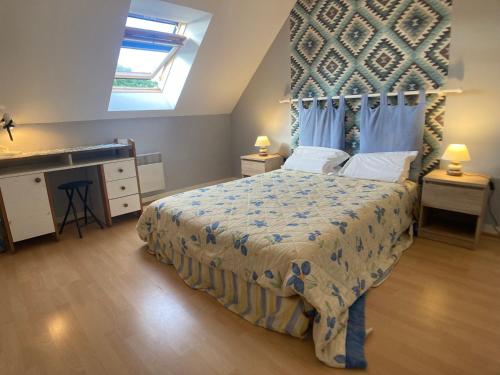 a bedroom with a large bed with a canopy at Une jolie maison climatisée pour vous reposer in Blois