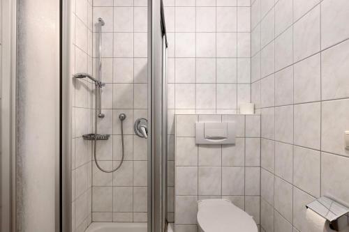 a bathroom with a shower and a toilet at Apartment 44 in Bad Dürrheim