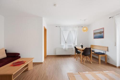 a living room with a couch and a table at Apartment 45 in Bad Dürrheim