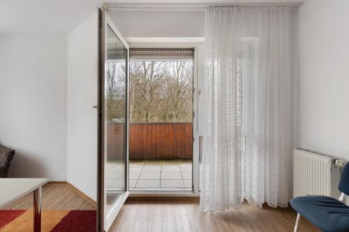 a room with a glass door with a window at Apartment 30 in Bad Dürrheim