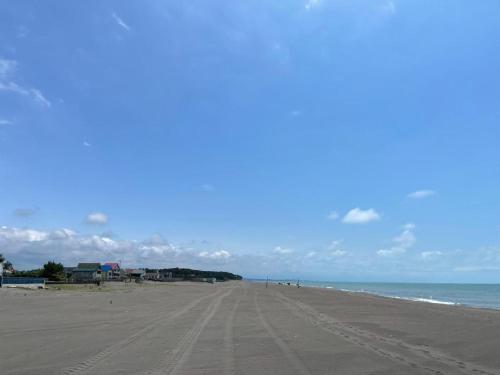 an empty beach with footprints in the sand at jibo in Grigoleti