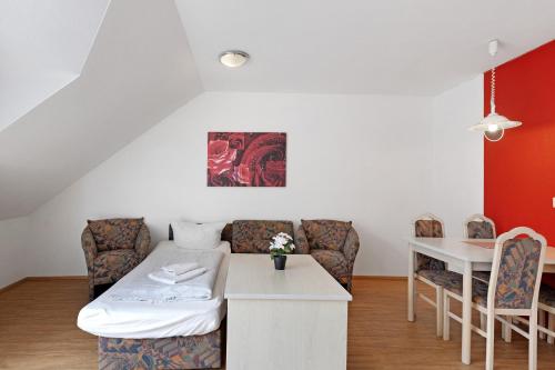 a living room with a couch and a table at Apartment 36 in Bad Dürrheim